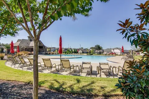 a view of a park with swings and slides
