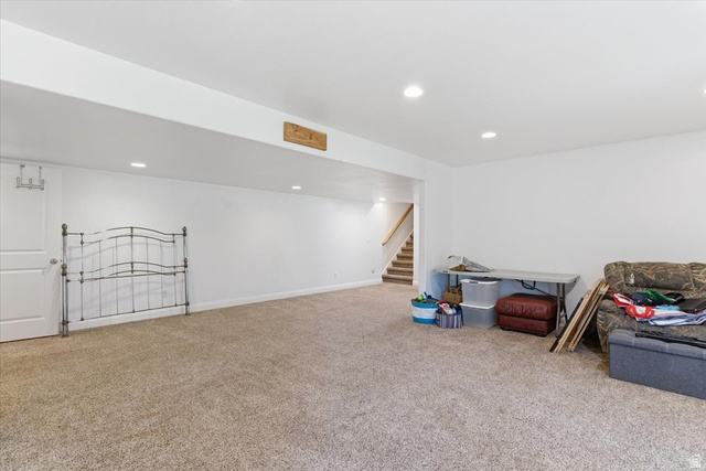 6237 West 4600th Street South Hooper, UT 84315 - Photo 31 of 48 Finished below grade area with carpet floors and recessed lighting