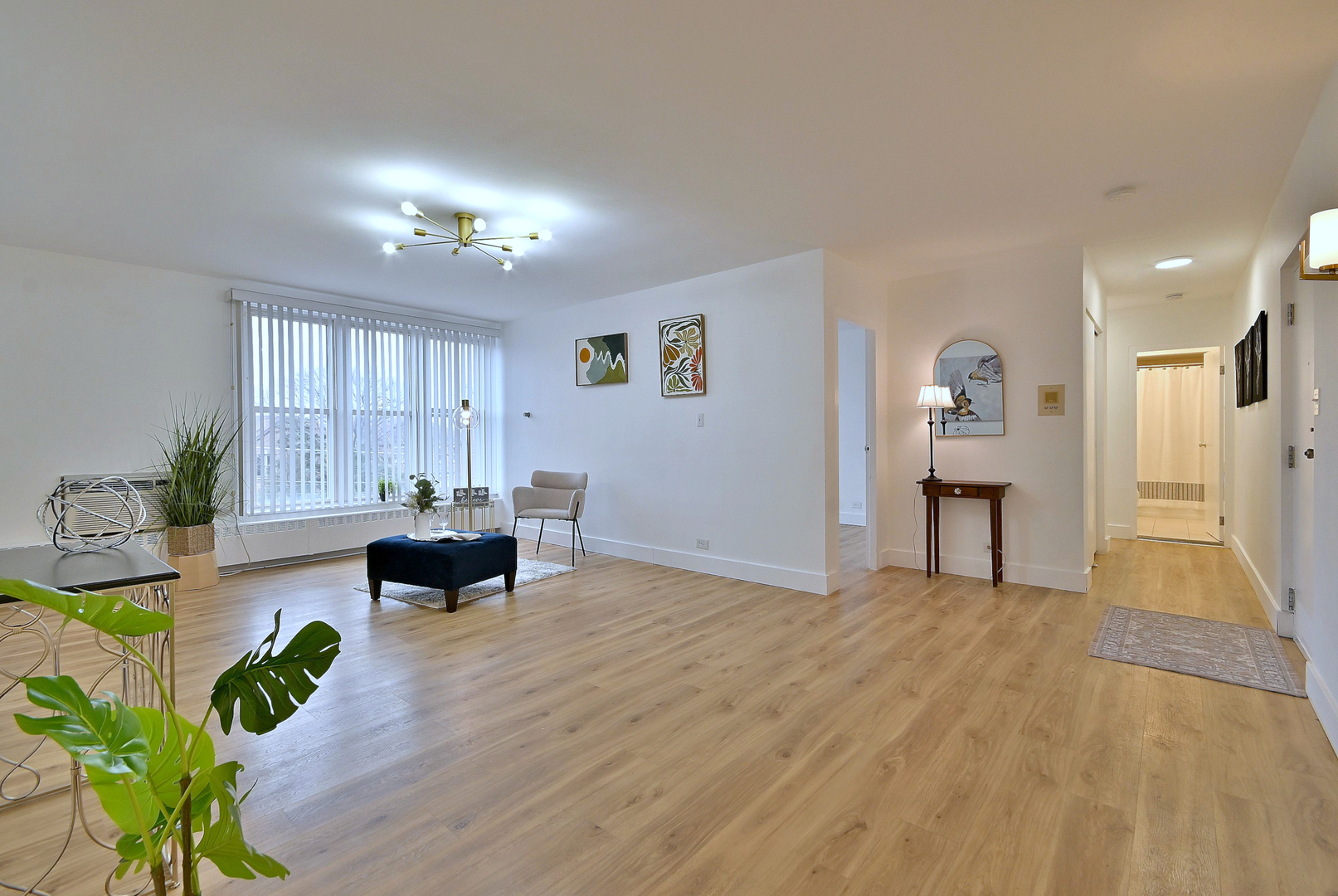 1301 West Touhy Avenue, Unit 315 Park Ridge, IL 60068 - Photo 2 of 17 a view of livingroom with dining room and wooden floor