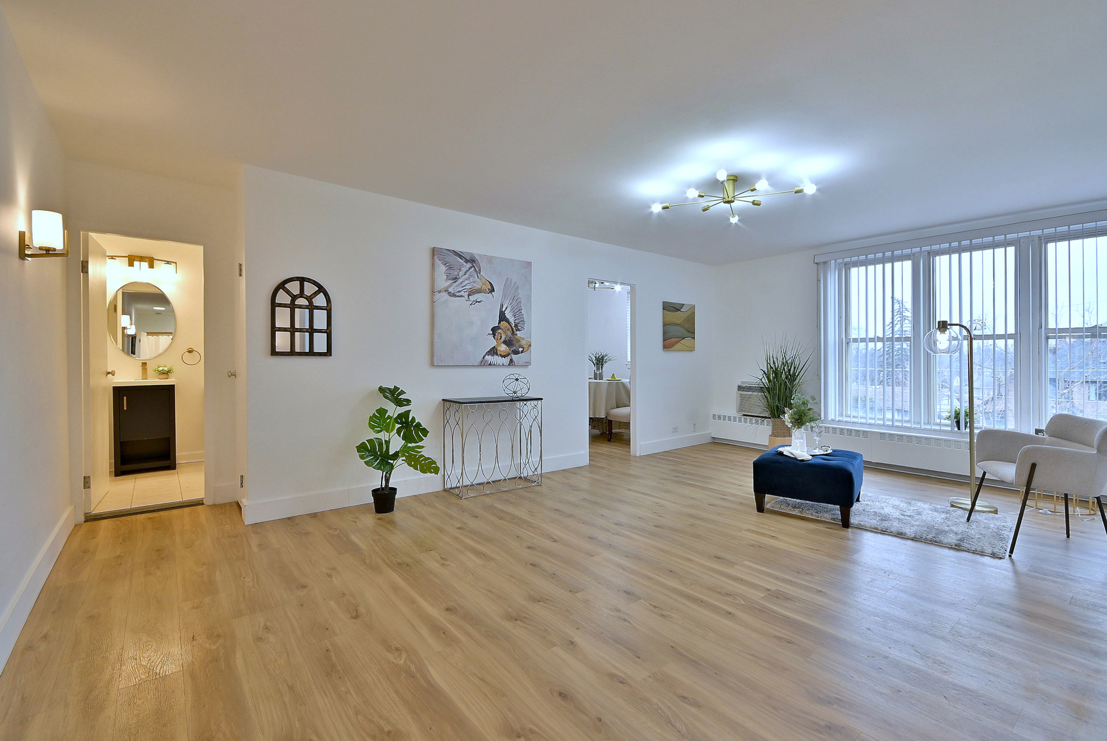 1301 West Touhy Avenue, Unit 315 Park Ridge, IL 60068 - Photo 4 of 17 a living room with furniture and a wooden floor