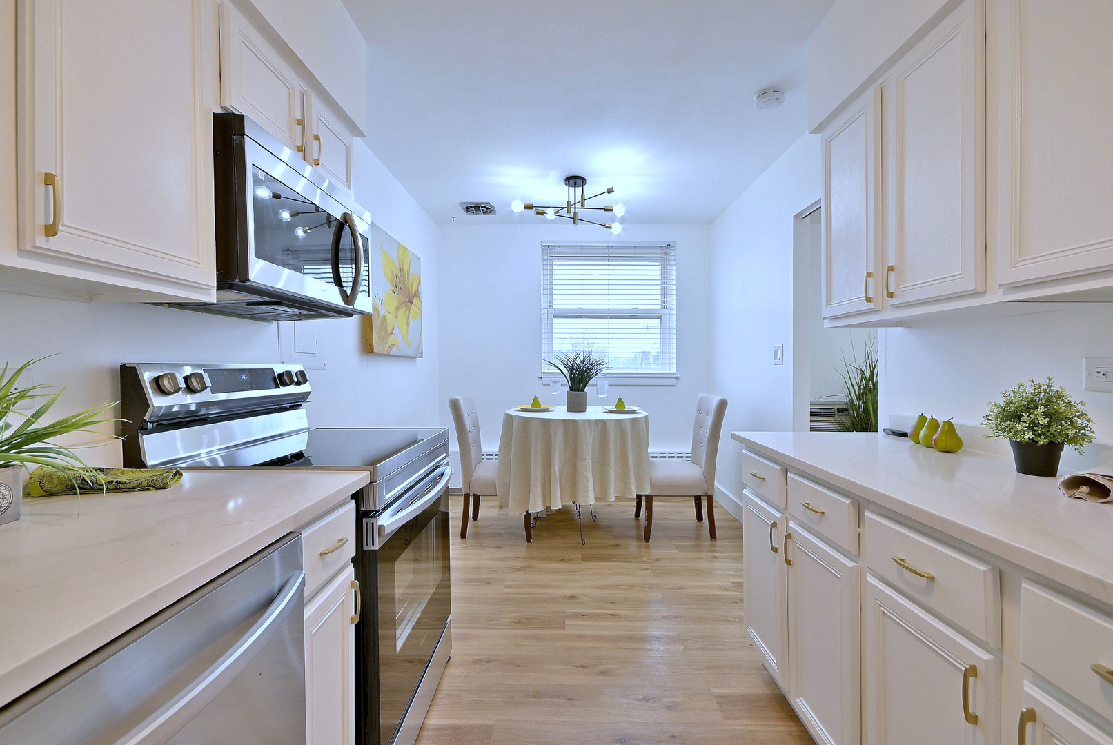 1301 West Touhy Avenue, Unit 315 Park Ridge, IL 60068 - Photo 8 of 17 a kitchen with cabinets a sink and appliances