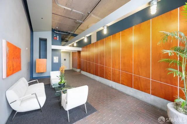 a view of a small space with wooden floor and closet