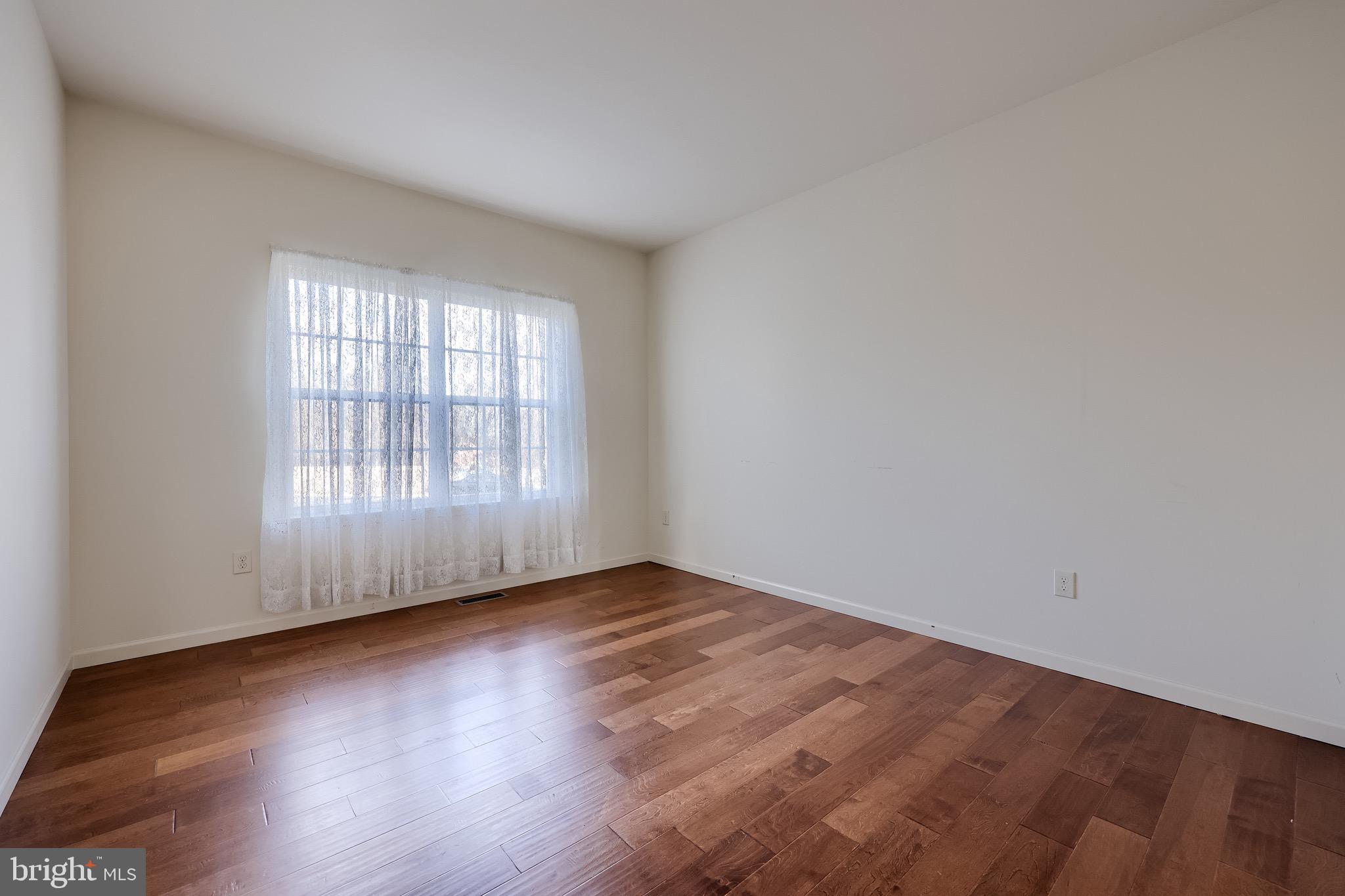 95 Hunters Chase Etters, PA 17319 - Photo 38 of 73 an empty room with wooden floor and windows