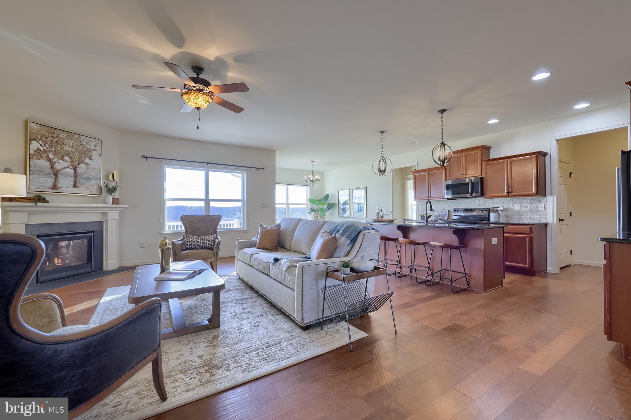 95 Hunters Chase Etters, PA 17319 - Photo 47 of 73 a living room with furniture a fireplace and a chandelier