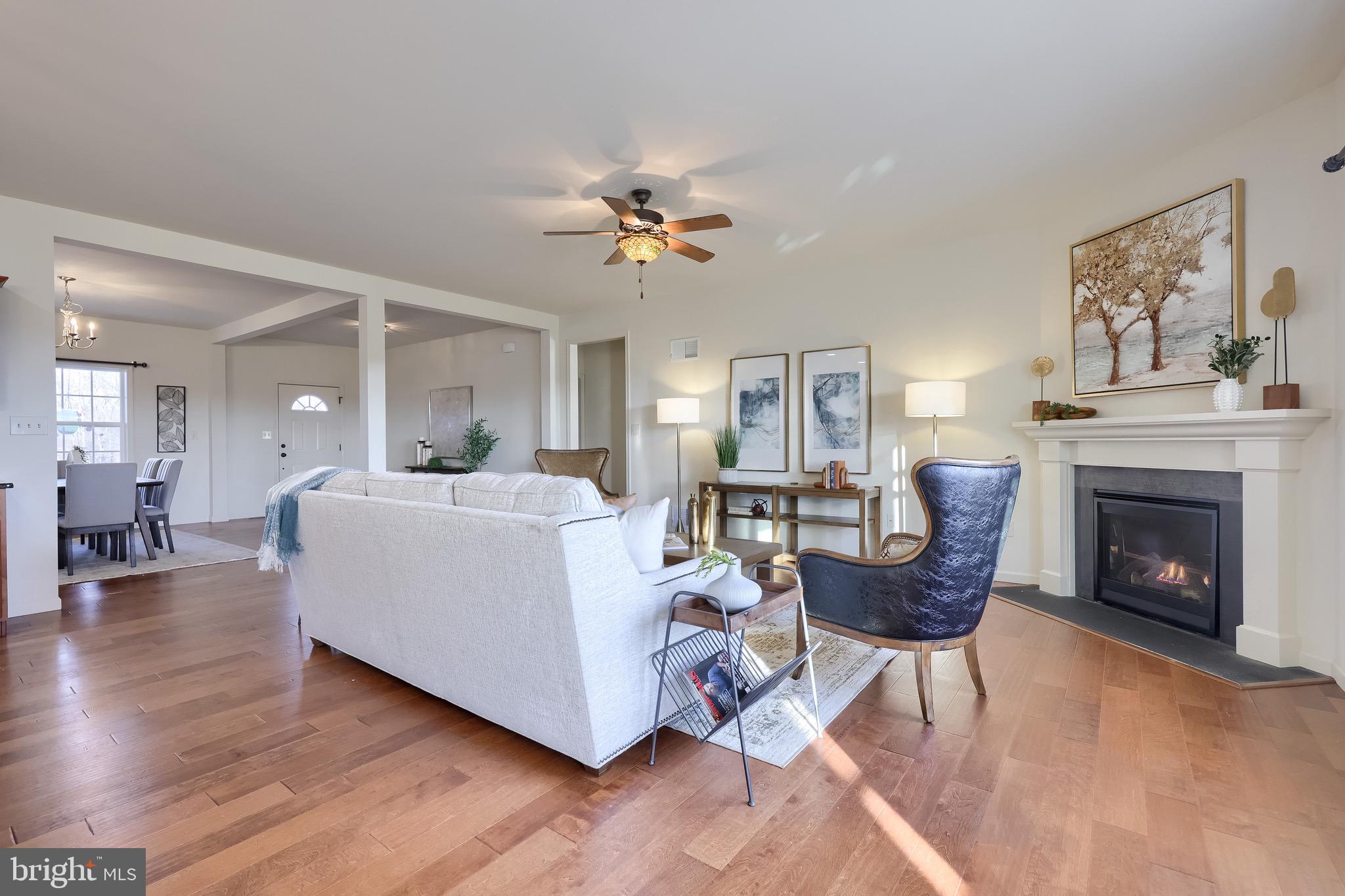 95 Hunters Chase Etters, PA 17319 - Photo 51 of 73 a living room with furniture a fireplace and wooden floor