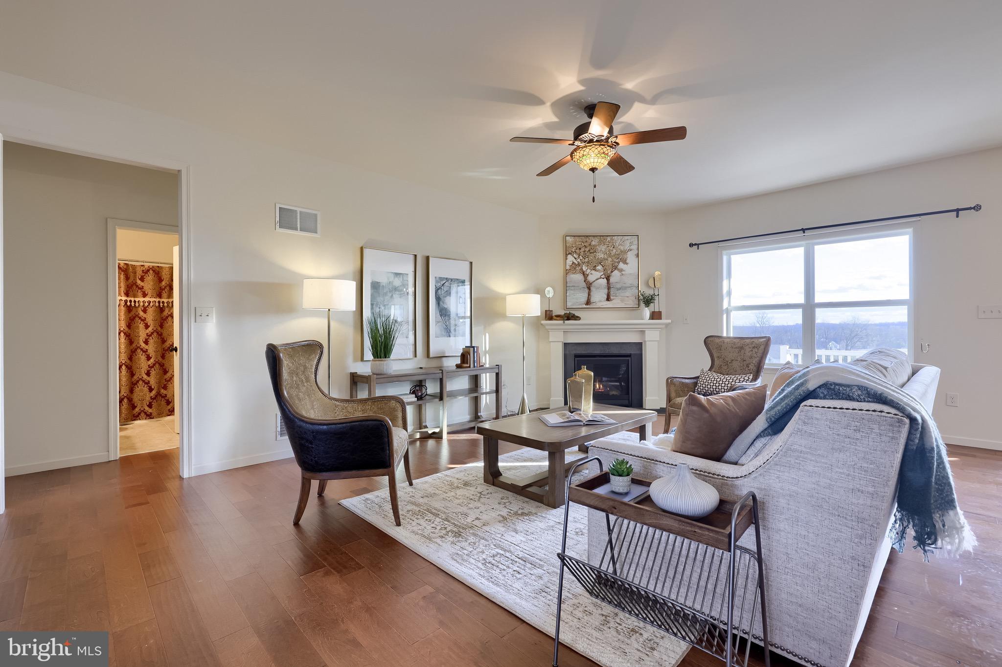95 Hunters Chase Etters, PA 17319 - Photo 54 of 73 a living room with furniture a fireplace and a chandelier