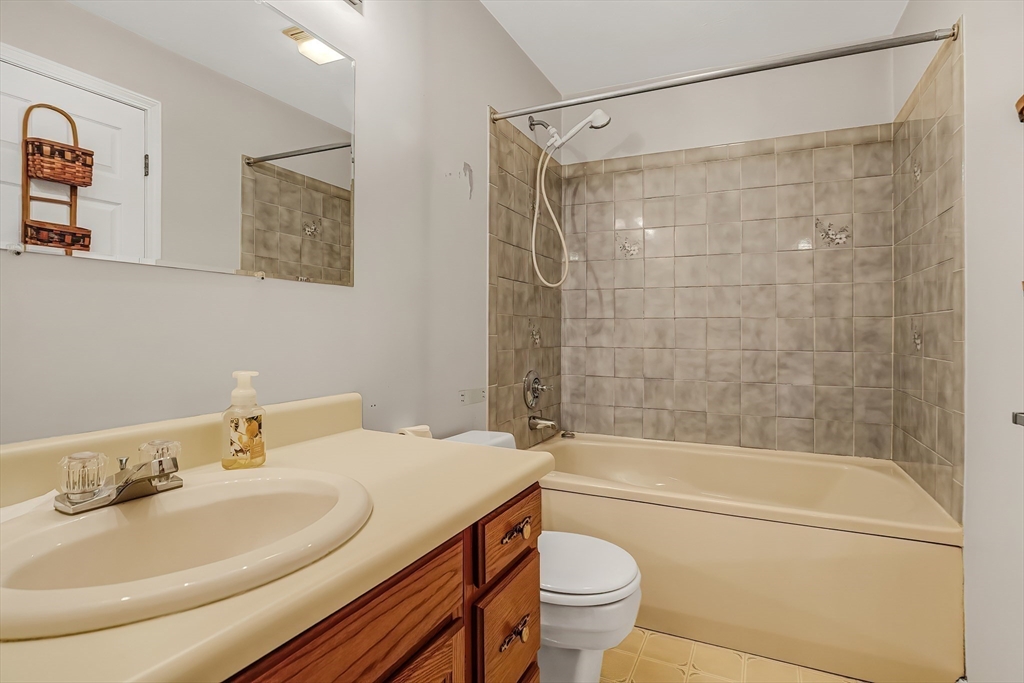 67 Providence Road, Unit 1 Grafton, MA 01519 - Photo 12 of 23 a bathroom with a sink toilet and shower