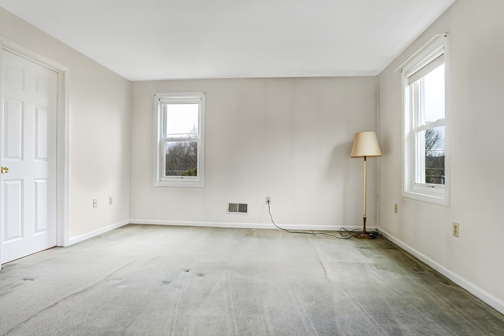 67 Providence Road, Unit 1 Grafton, MA 01519 - Photo 15 of 23 an empty room with windows