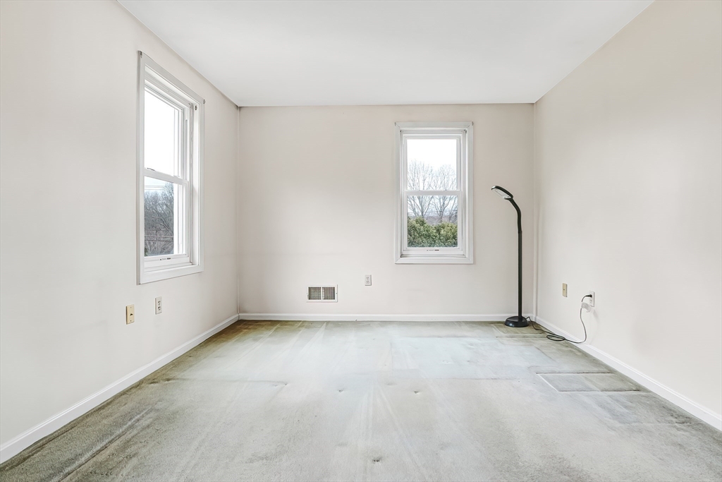 67 Providence Road, Unit 1 Grafton, MA 01519 - Photo 17 of 23 an empty room with windows