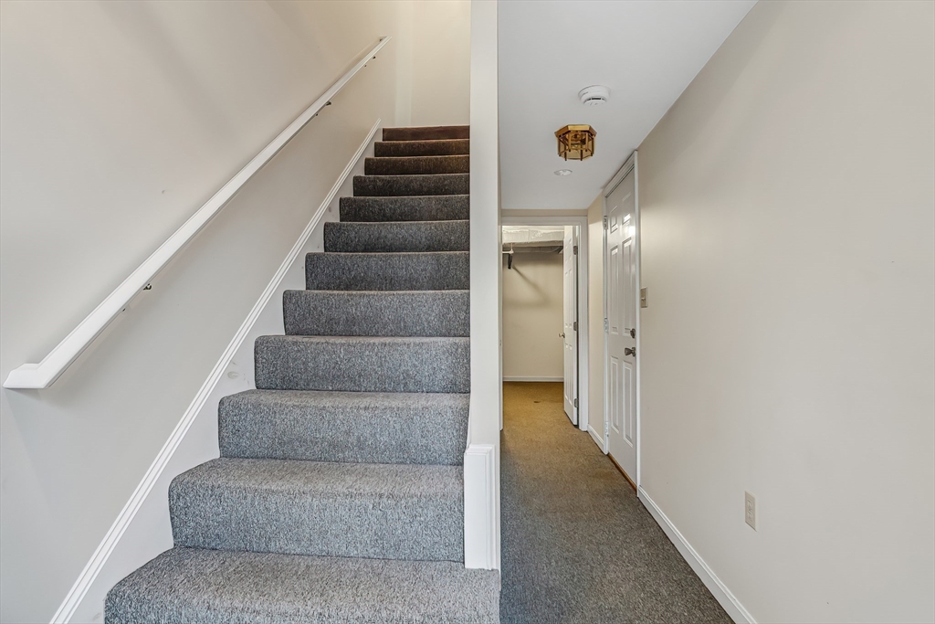 67 Providence Road, Unit 1 Grafton, MA 01519 - Photo 18 of 23 a view of staircase with white walls
