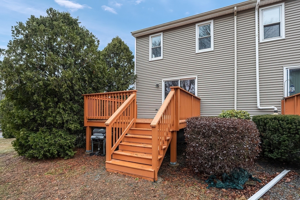 67 Providence Road, Unit 1 Grafton, MA 01519 - Photo 22 of 23 a view of a house with a yard and stairs