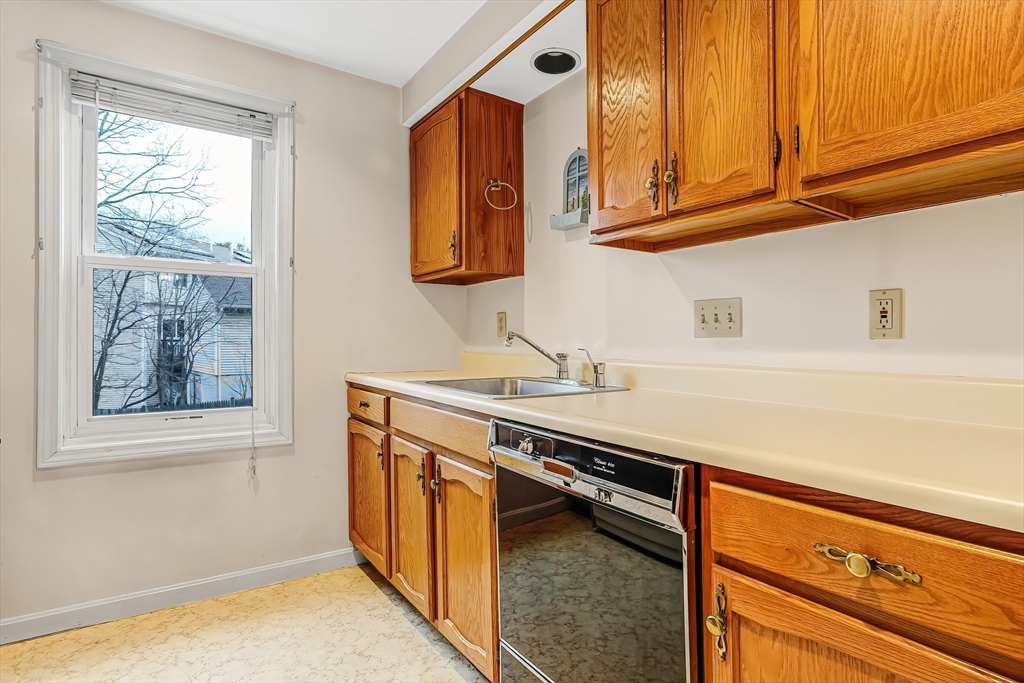 67 Providence Road, Unit 1 Grafton, MA 01519 - Photo 4 of 23 a kitchen with stainless steel appliances granite countertop a sink and a cabinets