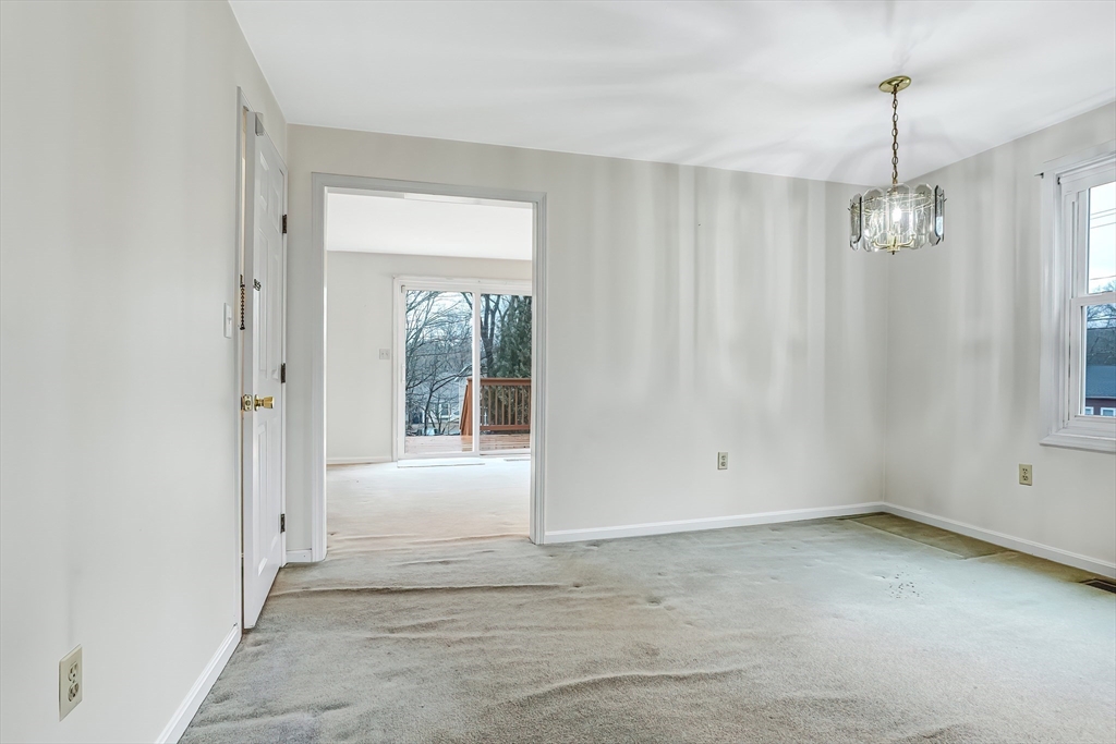 67 Providence Road, Unit 1 Grafton, MA 01519 - Photo 7 of 23 a view of an empty room with a window