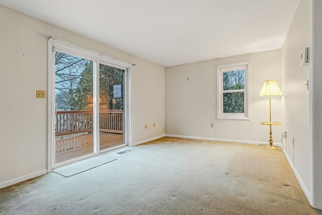 67 Providence Road, Unit 1 Grafton, MA 01519 - Photo 9 of 23 an empty room with windows