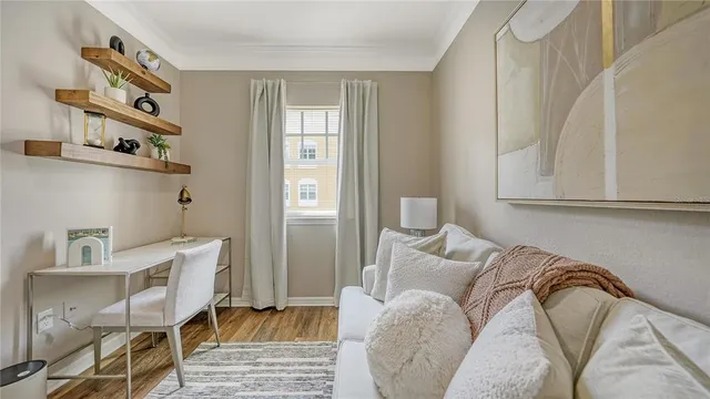 a bedroom with a bed and a chair