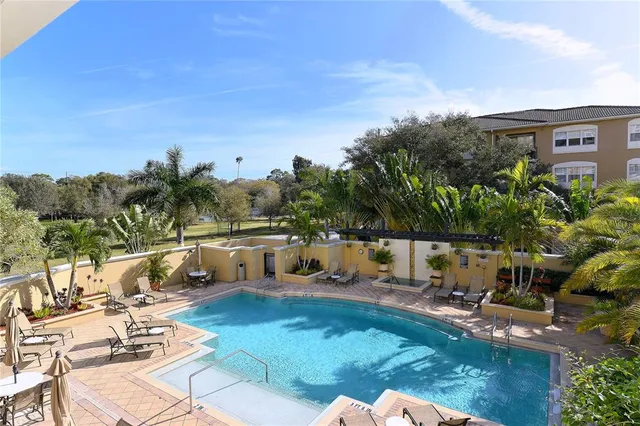 a view of a swimming pool with a patio