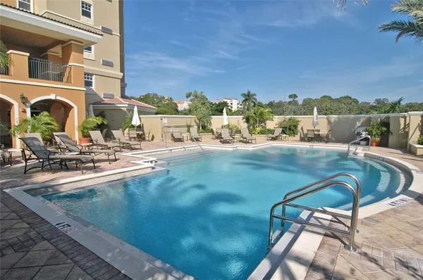 a view of a swimming pool with a lounge chairs