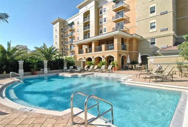 a view of a swimming pool with a lounge chairs