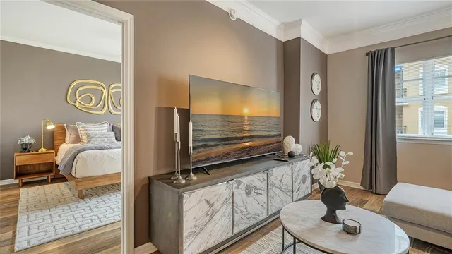 a living room with furniture and a flat screen tv