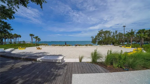 a view of swimming pool with a yard and lake view