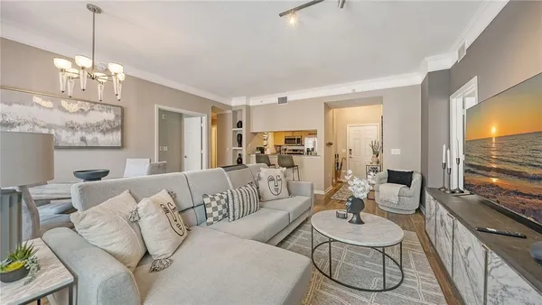 a living room with furniture dining table and a large window