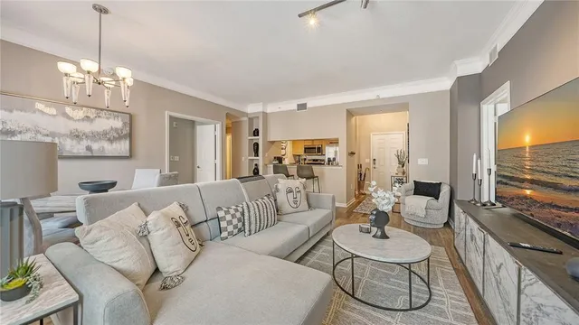 a living room with furniture dining table and a large window