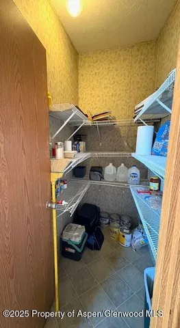 a view of roof deck with car parked