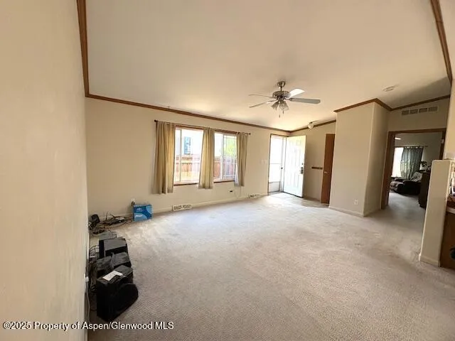 a view of livingroom with hardwood floor and a ceiling fan