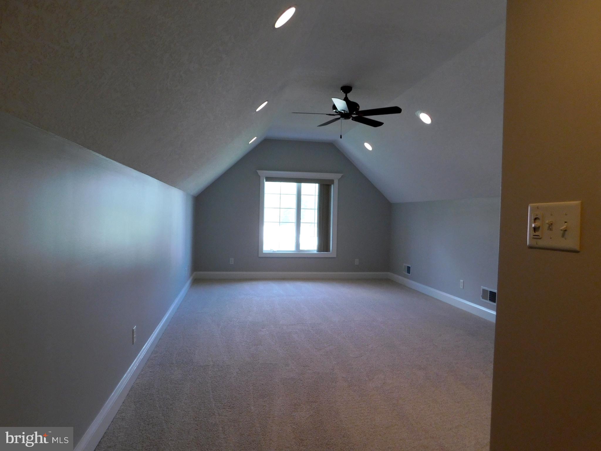 487 Brookfield Drive Dover, DE 19901 - Photo 14 of 45 an empty room with a window and a ceiling fan