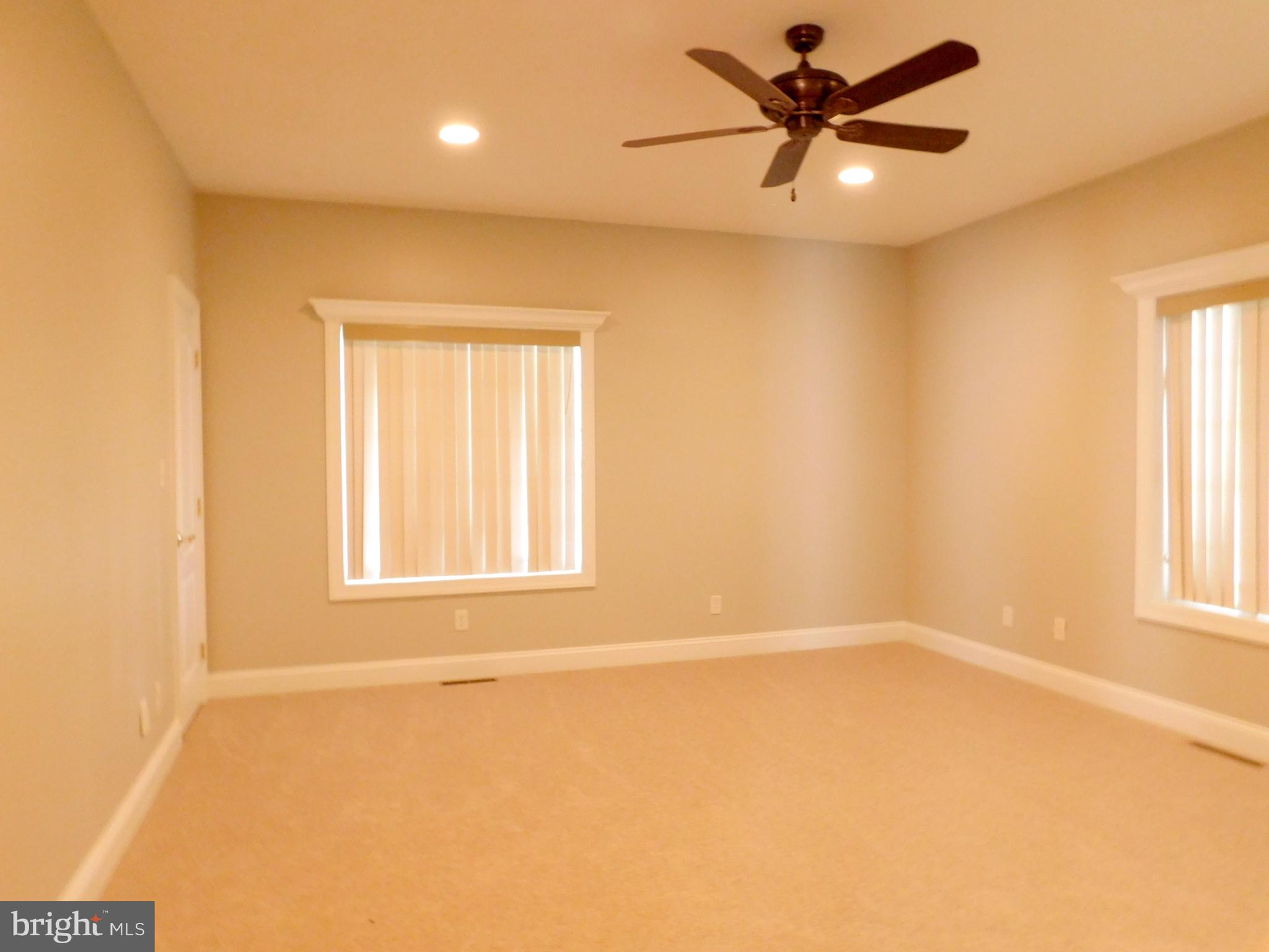 487 Brookfield Drive Dover, DE 19901 - Photo 9 of 45 a view of a livingroom with a window and a ceiling fan