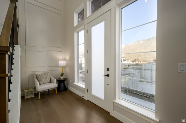 250 South Main Street, Unit 9 Alpine, UT 84004 - Photo 6 of 34 Doorway featuring a decorative wall, wood finished floors, healthy amount of natural light, and a mountain view