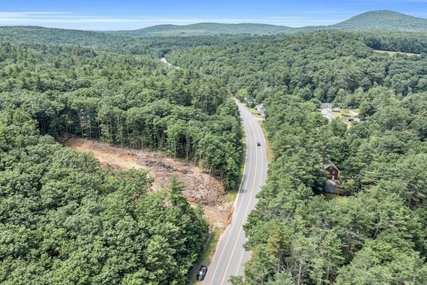 Lot 3 West State Road Ashby, MA 01431 - Photo 11 of 14 a view of a lush green forest with trees and some houses