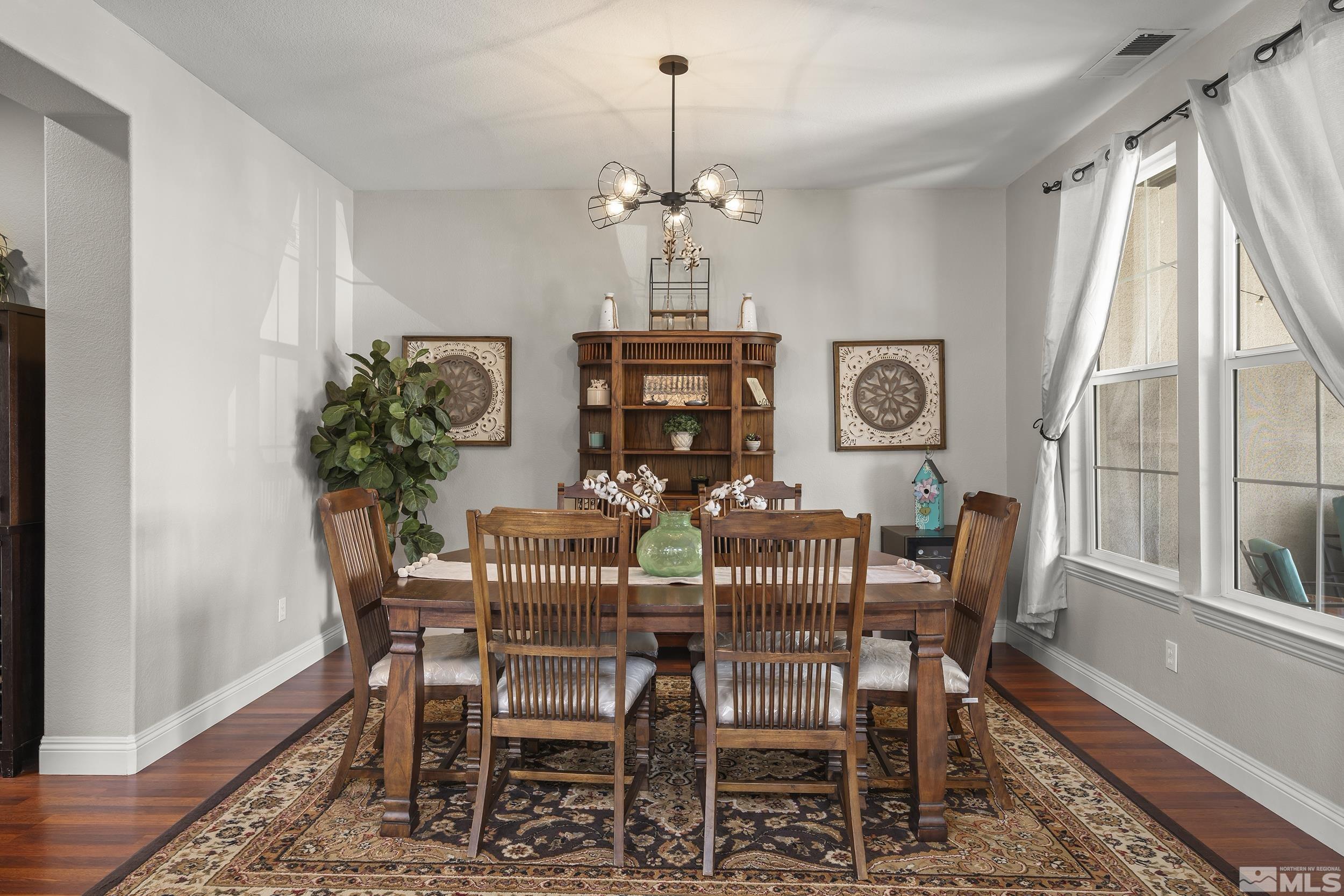 641 Aberdeen Court Reno, NV 89521 - Photo 13 of 39 a view of a dining room with furniture window and wooden floor