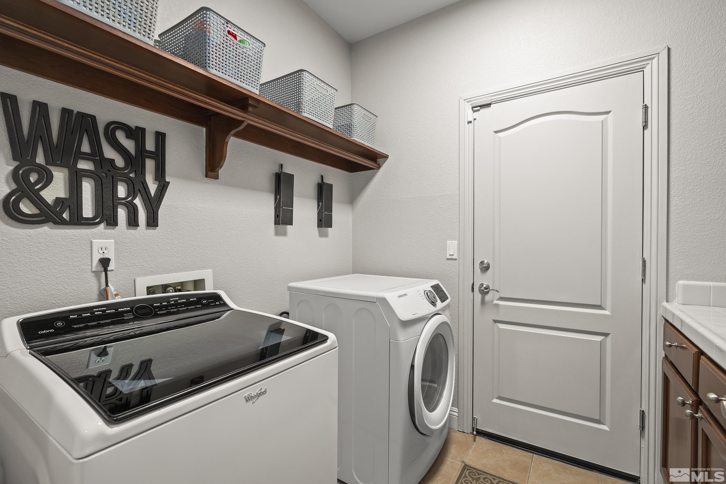 641 Aberdeen Court Reno, NV 89521 - Photo 17 of 39 a utility room with dryer and washer