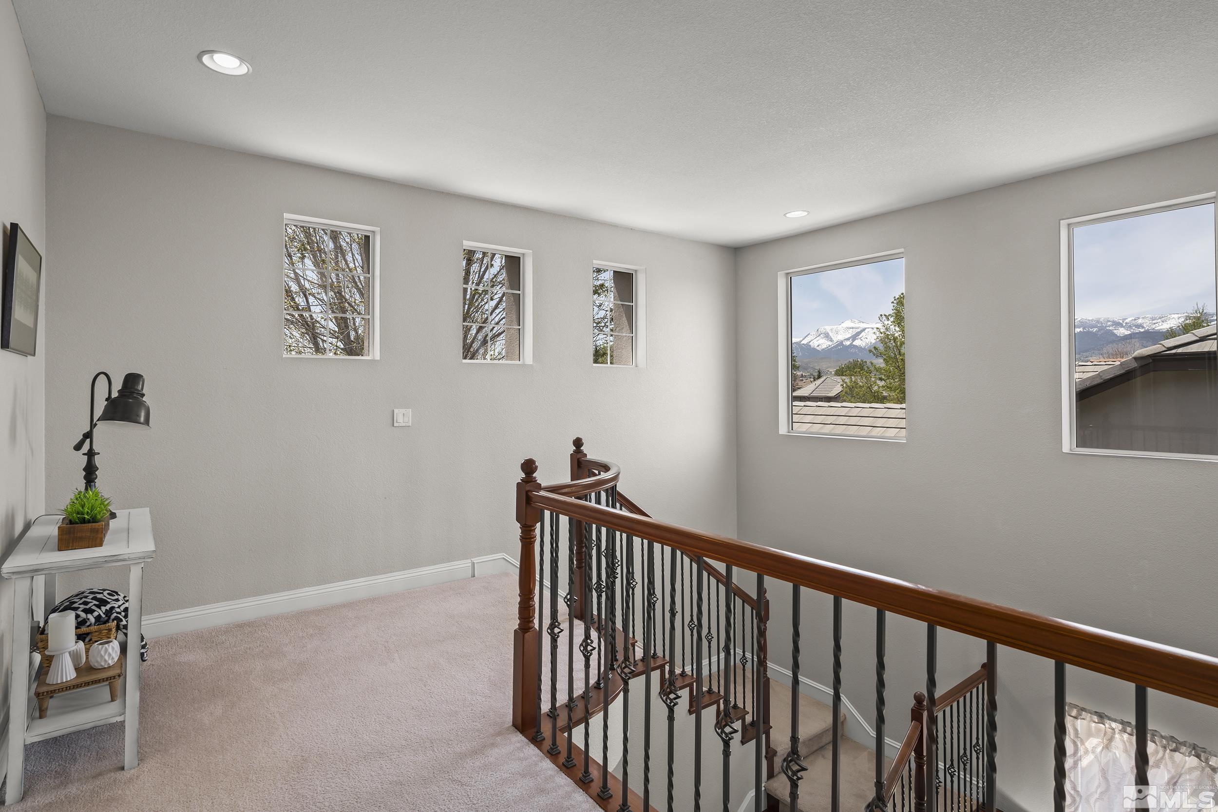641 Aberdeen Court Reno, NV 89521 - Photo 20 of 39 a view of hallway with furniture and wooden floor