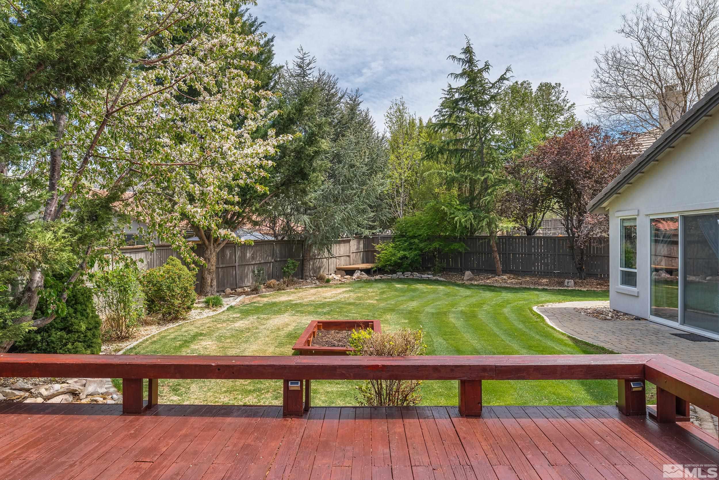 641 Aberdeen Court Reno, NV 89521 - Photo 33 of 39 a view of backyard with wooden fence