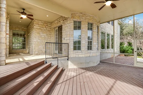 a view of a balcony with wooden floor
