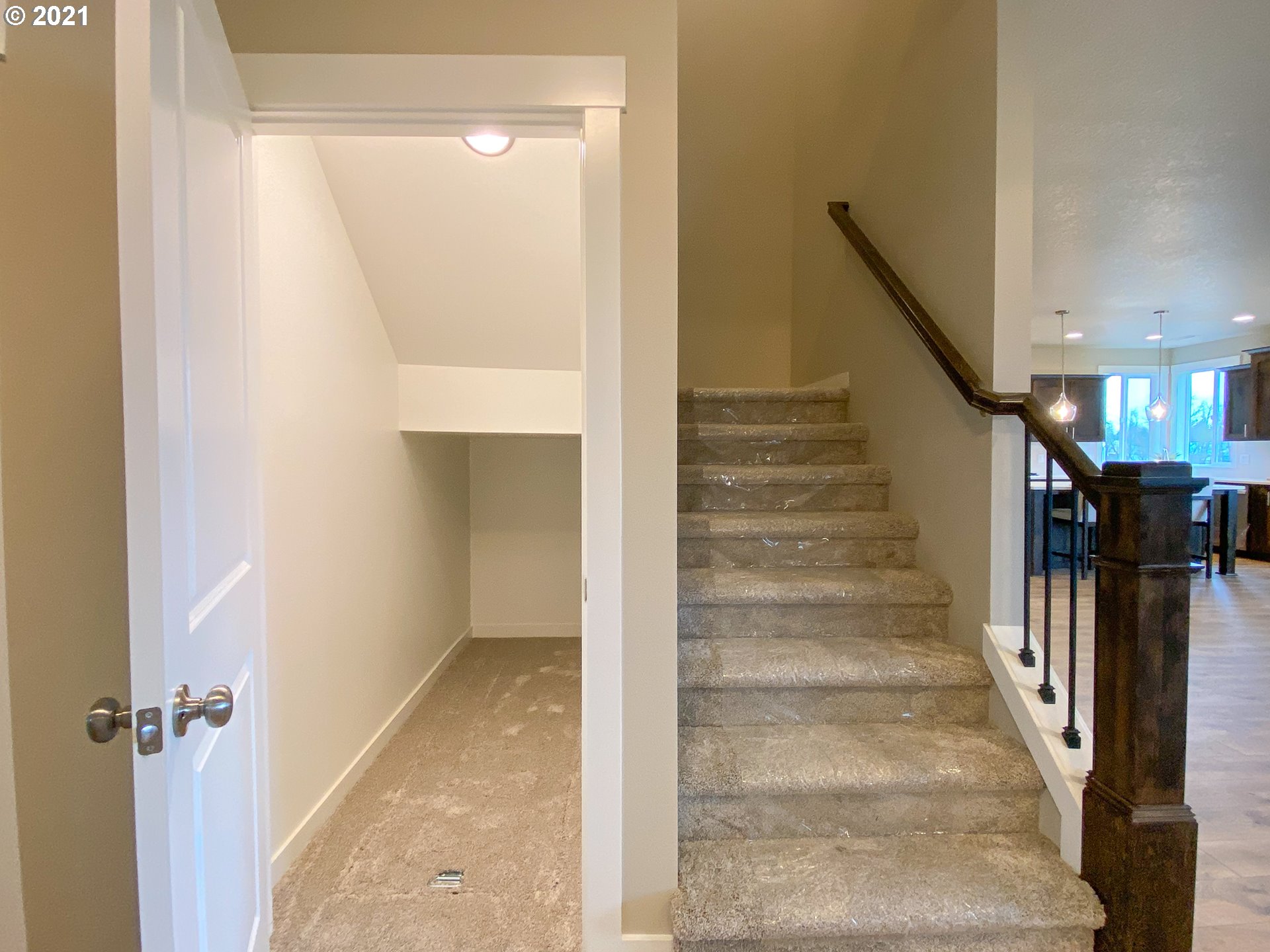 905 South Goose Loop Ridgefield, WA 98642 - Photo 22 of 29 a view of a hallway with wooden floor and staircase