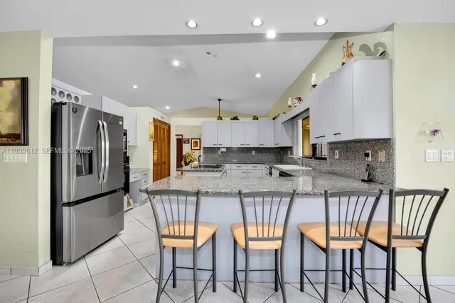 a bedroom with furniture and a flat screen tv