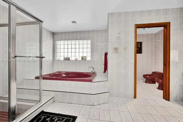 a kitchen with stainless steel appliances a refrigerator and cabinets