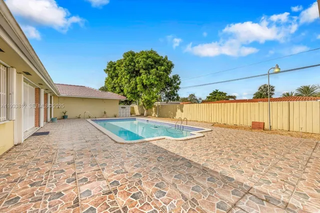 a view of a house with a swimming pool