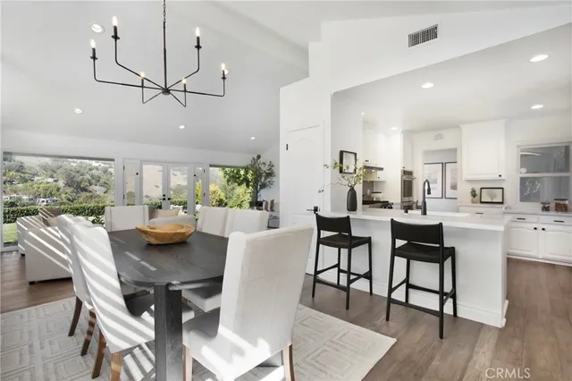 a bedroom with a large bed and a large window