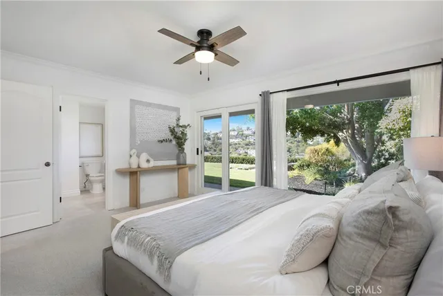 a bathroom with a double vanity sink mirror and bathtub