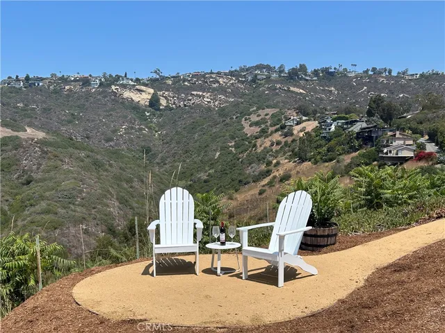 a view of a house with swimming pool and porch