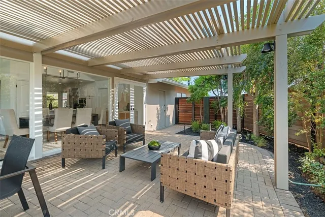 an aerial view of a residential houses with yard