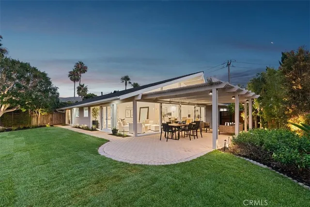 a view of a house with a yard porch and sitting area