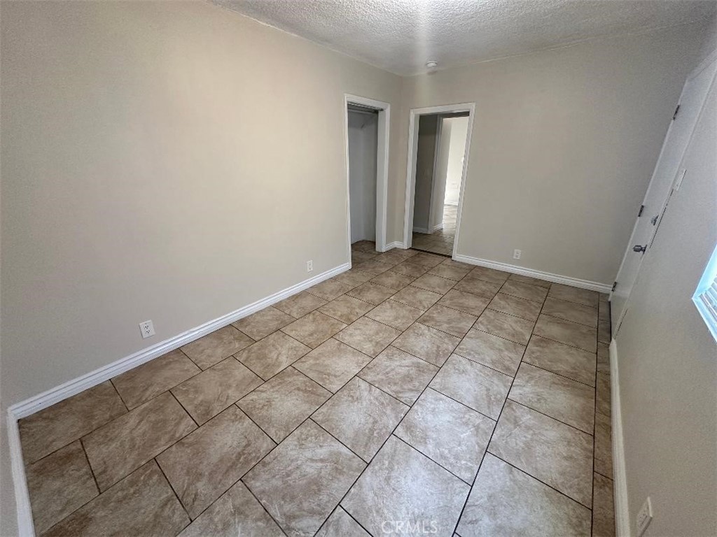10516 Clovis Avenue Los Angeles, CA 90002 - Photo 11 of 13 a view of an empty room and staircase