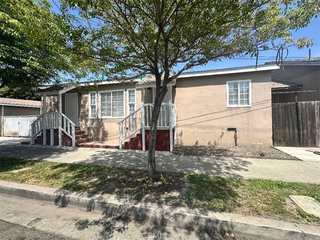 10516 Clovis Avenue Los Angeles, CA 90002 - Photo 13 of 13 a view of a house with a yard
