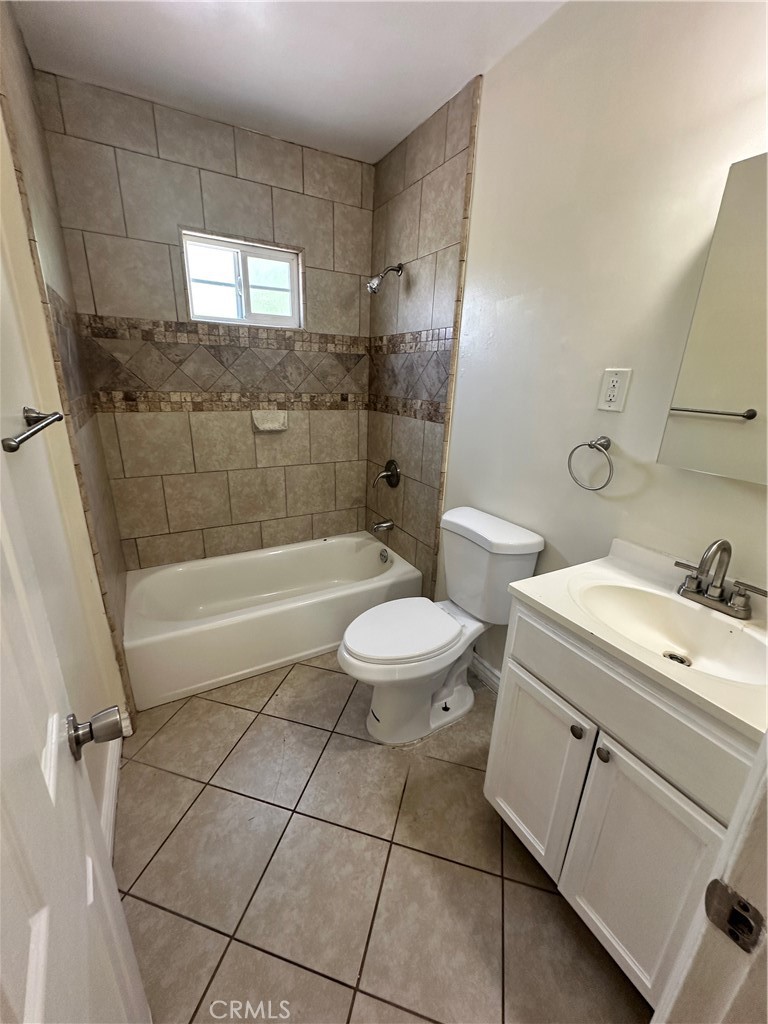 10516 Clovis Avenue Los Angeles, CA 90002 - Photo 6 of 13 a bathroom with a sink a toilet and shower