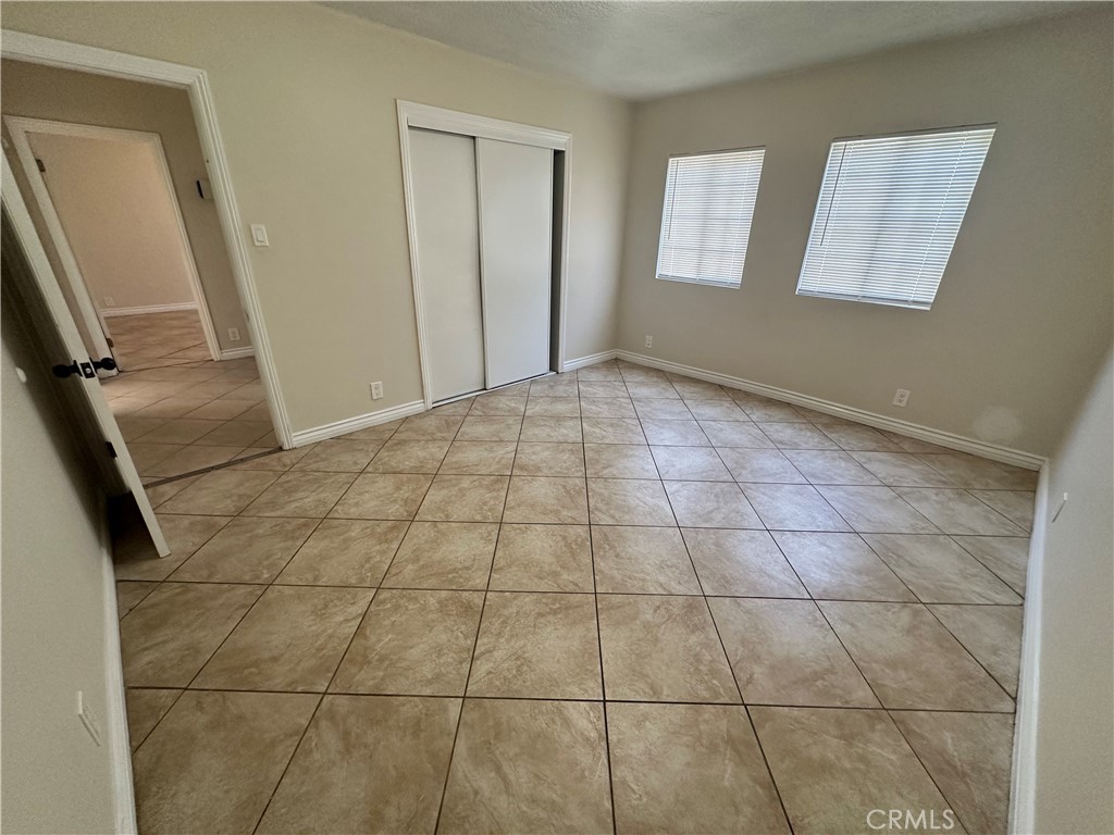 10516 Clovis Avenue Los Angeles, CA 90002 - Photo 7 of 13 a view of an empty room and a window